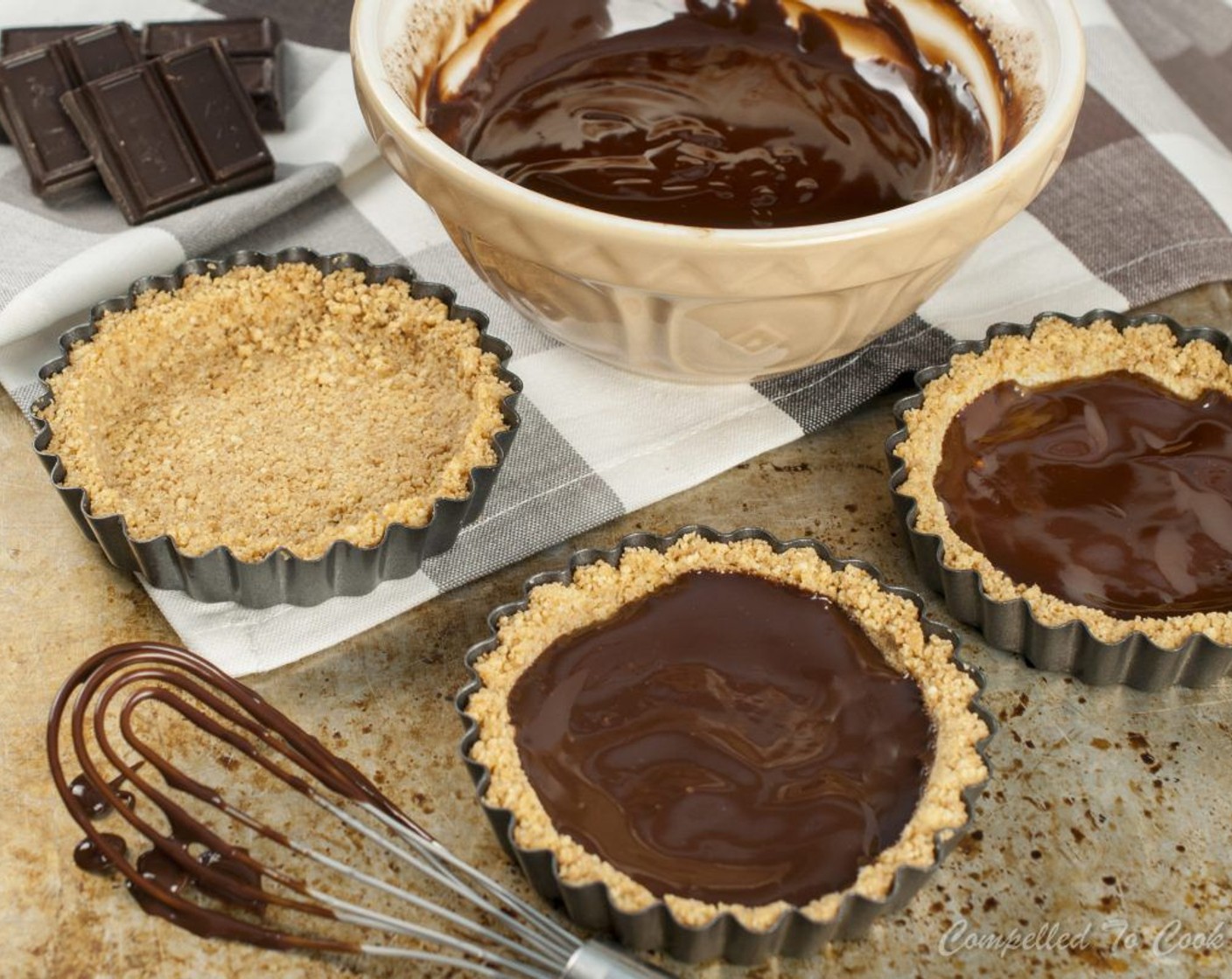 step 8 Scoop 1 tablespoon of ganache into cooled tart shells and spread out evenly over the bottom. Reserve remaining ganache for drizzling. Refrigerate tart shells for 15-20 minutes to firm up ganache.