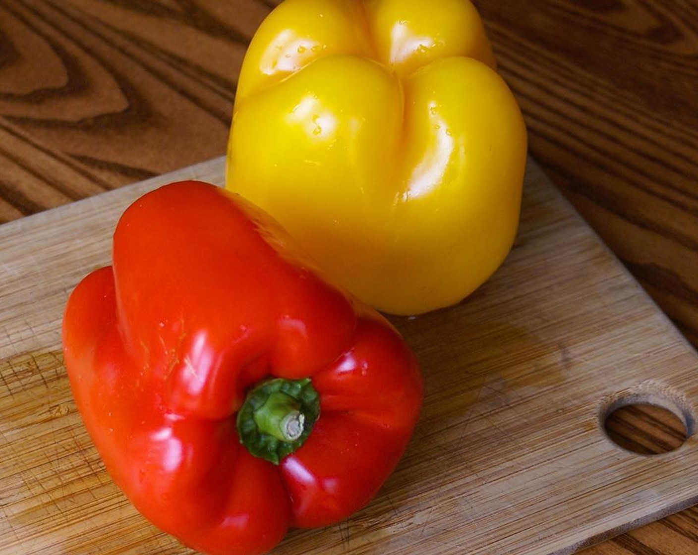 step 2 Cut the Bell Peppers (2) in half (from top to bottom), scrape out the seeds and cut out the stem.