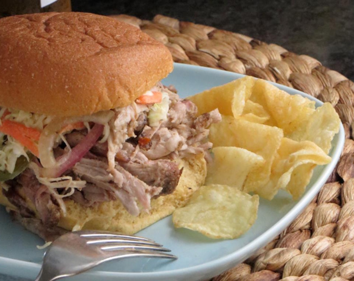 step 14 Add pieces of skin and fat back to the meat to suit your tastes. To serve, pile pork on Hamburger Buns (12) and top with a spoonful of Coleslaw Mix (to taste). Enjoy!