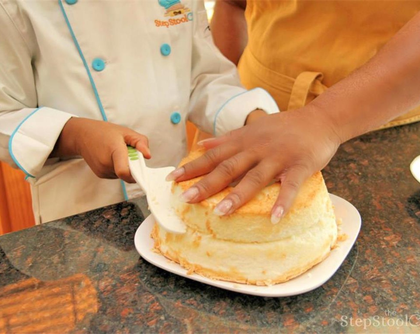 step 3 Next, slice the Angel Food Cake (1) across the middle allowing you to remove the top half of the cake and place on a separate plate.