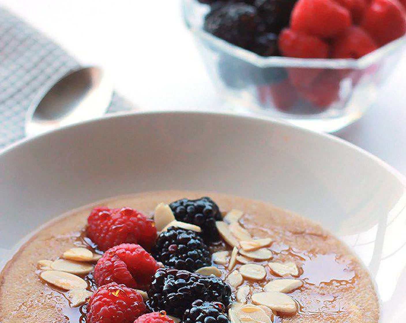 step 3 When amaranth is done, spoon into serving bowls, top with Fresh Mixed Berries (to taste) and Sliced Almonds (to taste) and drizzle with Maple Syrup (to taste). Serve and enjoy!