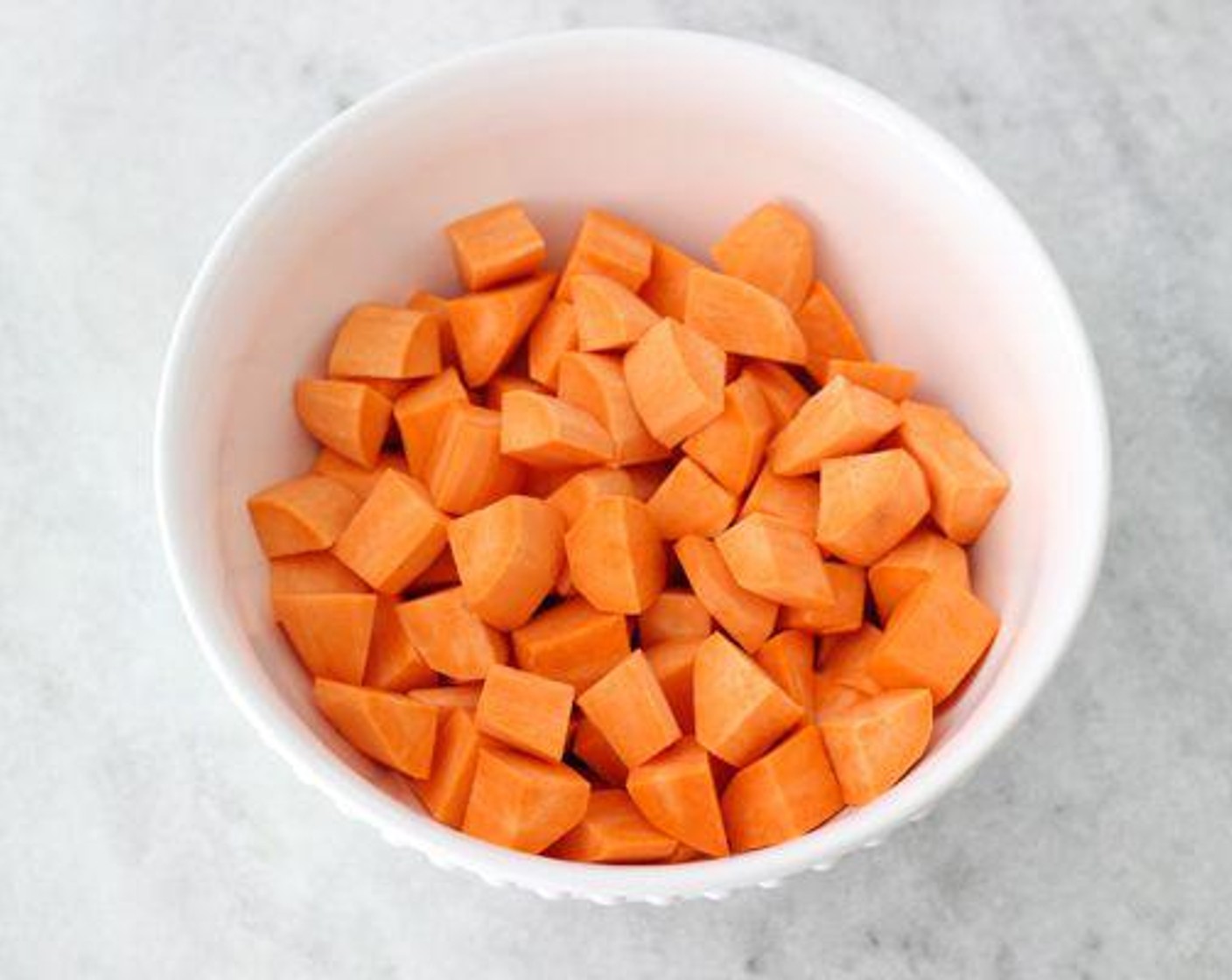 step 2 Peel and cut the Sweet Potatoes (2.5 lb) and Onion (1) into 1-inch pieces.