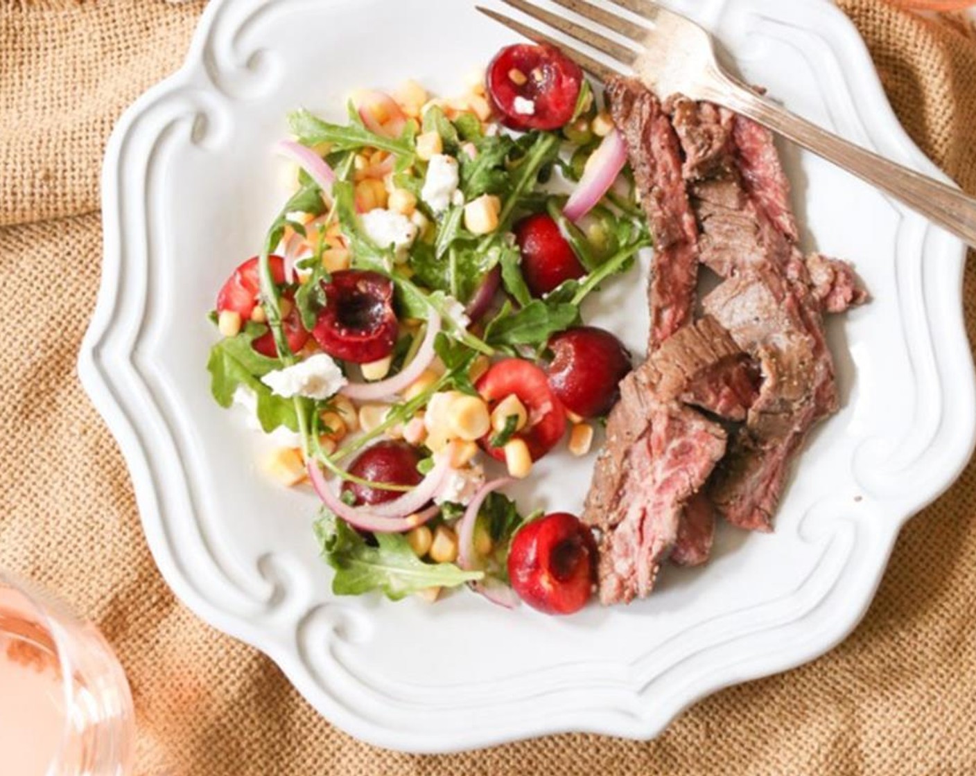 step 8 Transfer the salad to a serving bowl or plate and top with Goat Cheese (4 Tbsp) Serve the sliced steak alongside the salad.