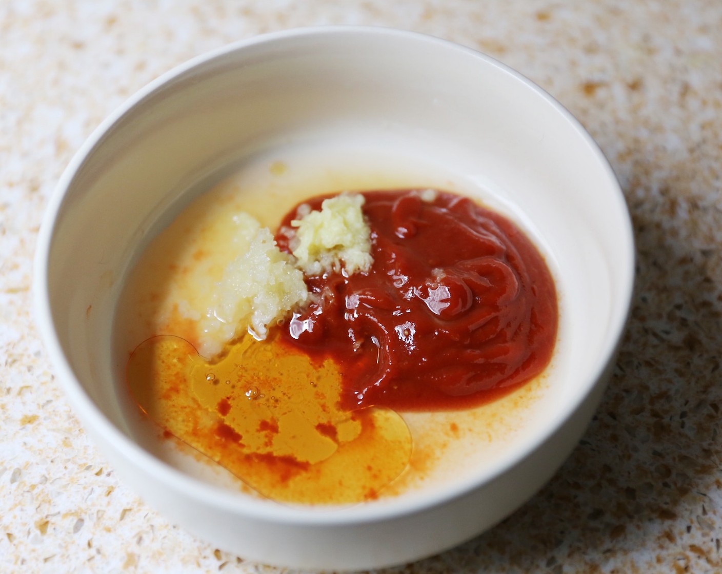 step 6 Combine the Chung Jung One® Gochujang Korean Chili Sauce (2 Tbsp), Garlic (1 clove), Fresh Ginger (1 tsp), Rice Vinegar (1 Tbsp), Honey (1 tsp) and Sesame Oil (1 tsp) in a small bowl.