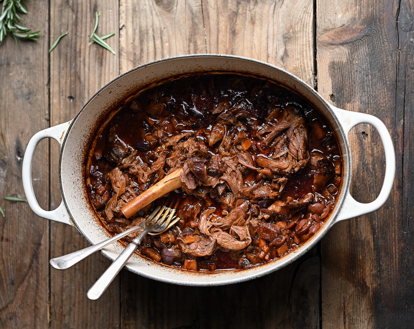 step 8 Use two forks to shred the meat, removing any bones and setting them aside. Carefully stir through the Black Olives (2 Tbsp) and season the shredded lamb to taste.