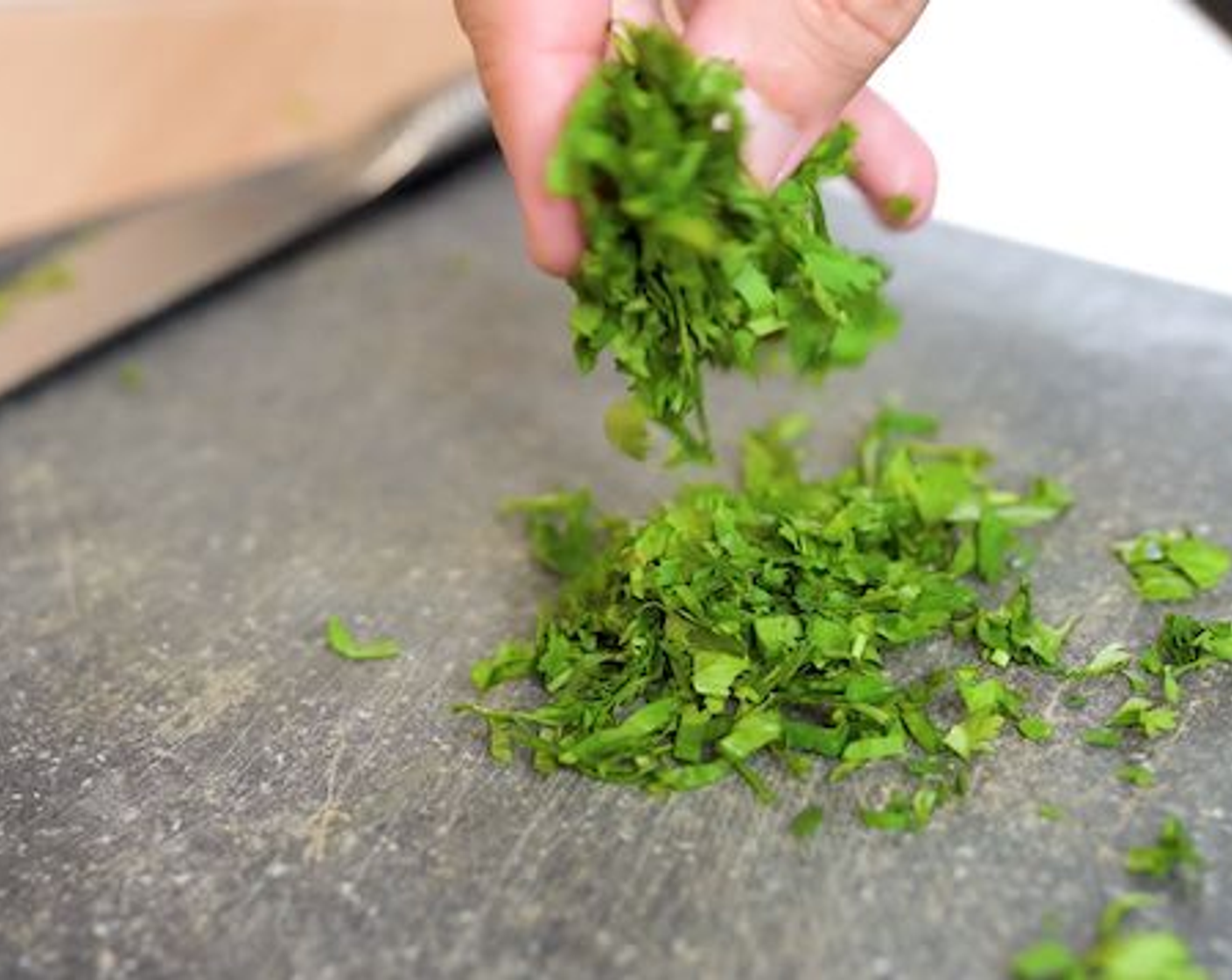 step 7 Next, to make the filling start  by separating the Fresh Cilantro (6 1/4 cups) leaves from the stems. Stack the leaves and roll, then chop the cilantro leaves. Next finely chop the cilantro stems.