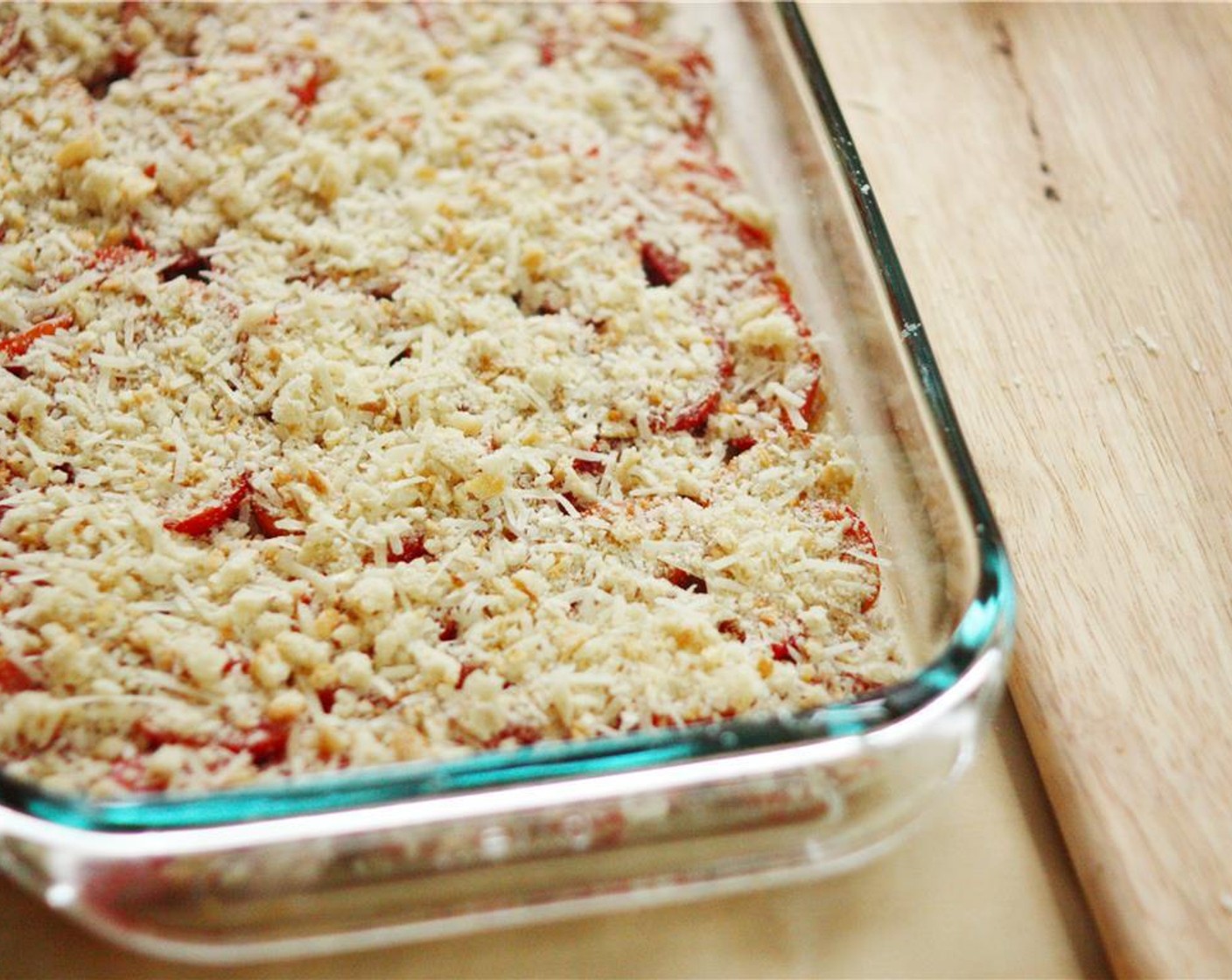 step 4 In a small bowl, combine Breadcrumbs (1/2 cup), Parmesan Cheese (1/4 cup), Pecorino Romano Cheese (1/4 cup), and Garlic (2 cloves) and mix with a fork. Sprinkle the mixture evenly over the tomatoes. Sprinkle Salt (1/4 tsp) and Ground Black Pepper (1/4 tsp) over the tomatoes and bread crumb mixture.