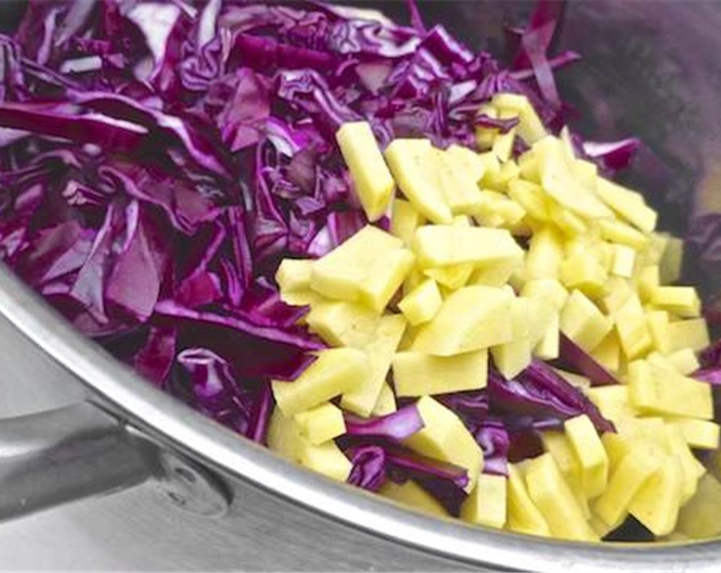 step 3 Add the chopped red cabbage and potato to the soft onion in the pan. Season generously with Ground Black Pepper (to taste) and Salt (to taste). Stir the vegetables well. Put a lid on the pan and cook for 5 minutes. Stir regularly.