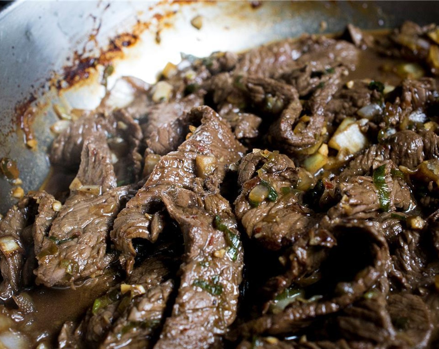 step 9 Warm the Vegetable Oil (2 Tbsp) in a large skillet over medium-high heat. In a single layer, add the beef drained from the marinade (work in batches if needed). Cook for 1 minute (do not move the beef). Sprinkle with a pinch of salt, then begin to stir and toss the beef for 1-2 minutes, until just cooked. Remove from heat and set aside.