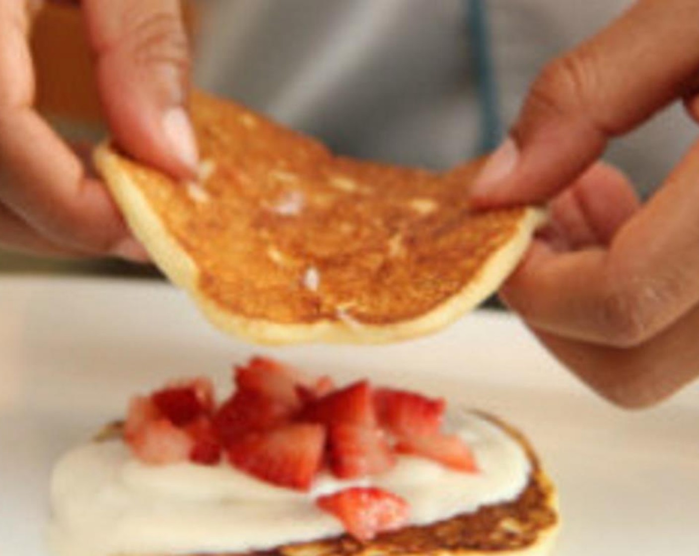 step 8 Assemble your three-layer strawberry pancakes. Place the pancake on a plate, add whipped cream and then strawberries, and repeat until you have three layers of everything!