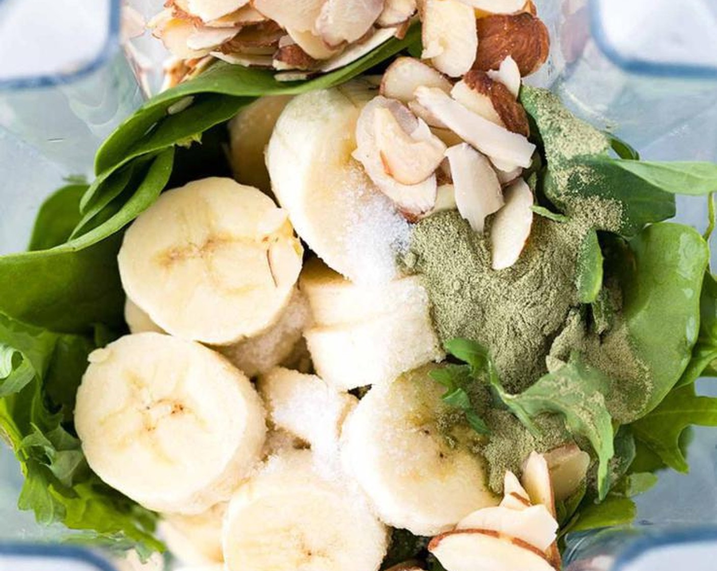 step 1 Add Ice (2 cups), Unsweetened Almond Milk (1 cup), Nonfat Plain Greek Yogurt (1/2 cup), Baby Kale (1 cup), Fresh Baby Spinach (1 cup), Banana (1), Sliced Almonds (1/4 cup), Matcha Powder (1 Tbsp), and Natural Sweetener (1/2 Tbsp) to the blender.
