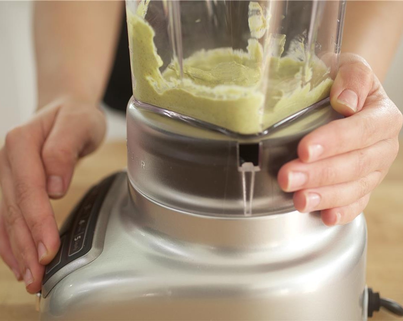 step 8 Add Sour Cream (1/4 cup), Ground Cumin (1/4 tsp), Chili Powder (1/4 tsp), Salt (1/4 tsp), and Ground Black Pepper (1/4 tsp) to the avocado, garlic, and lime juice in the blender. Blend until smooth.