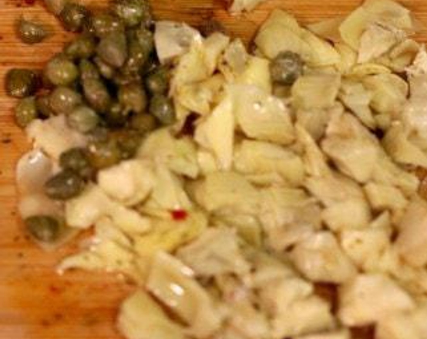 step 4 Add the Capers (1 Tbsp) and Marinated Artichokes (4) and stir for a minute.