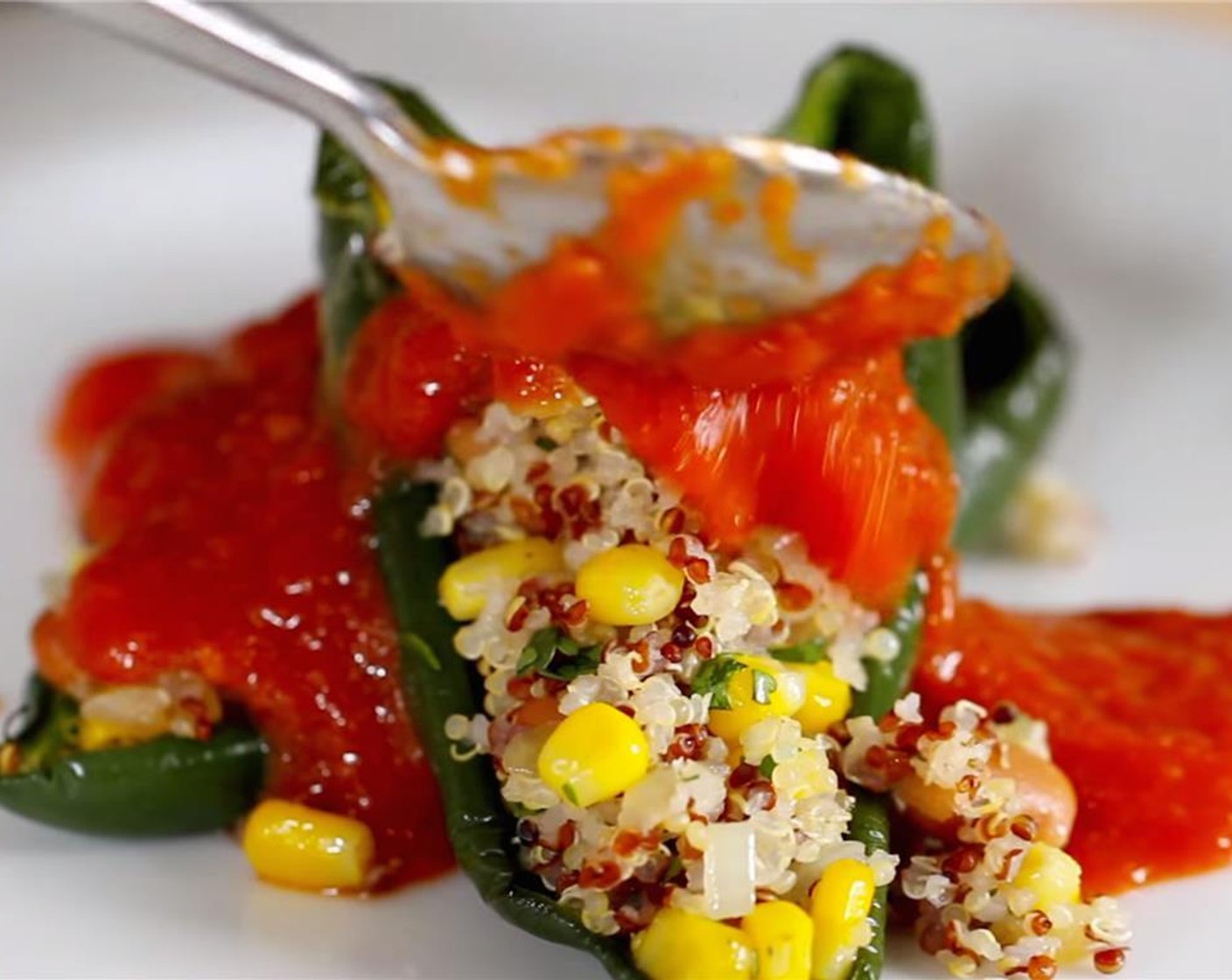 step 12 Transfer the stuffed chiles to a serving plate. Spoon the sauce over the peppers.