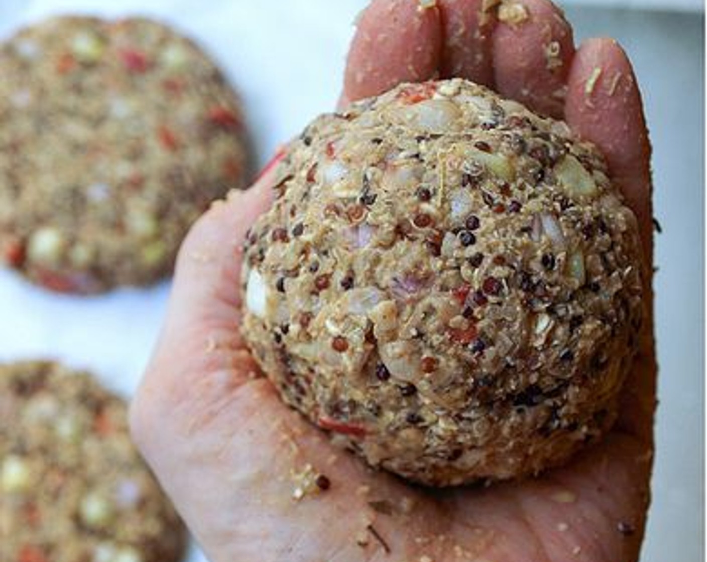 step 9 Now to divide and make your patties. I like to pat my mixture into the bowl a little and divide it with a knife into 4 sections, making a plus sign if you will. Take each section and pack it tightly into a ball in the palm of your hands. It should be about the size of your hand.