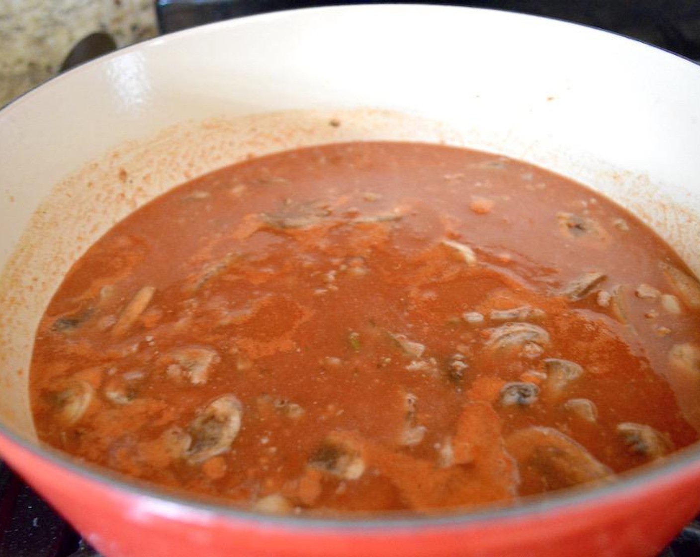 step 3 Pour in the Crushed Tomatoes (1 can) and Chicken Stock (2 cups). Let the soup simmer for 10-15 minutes.