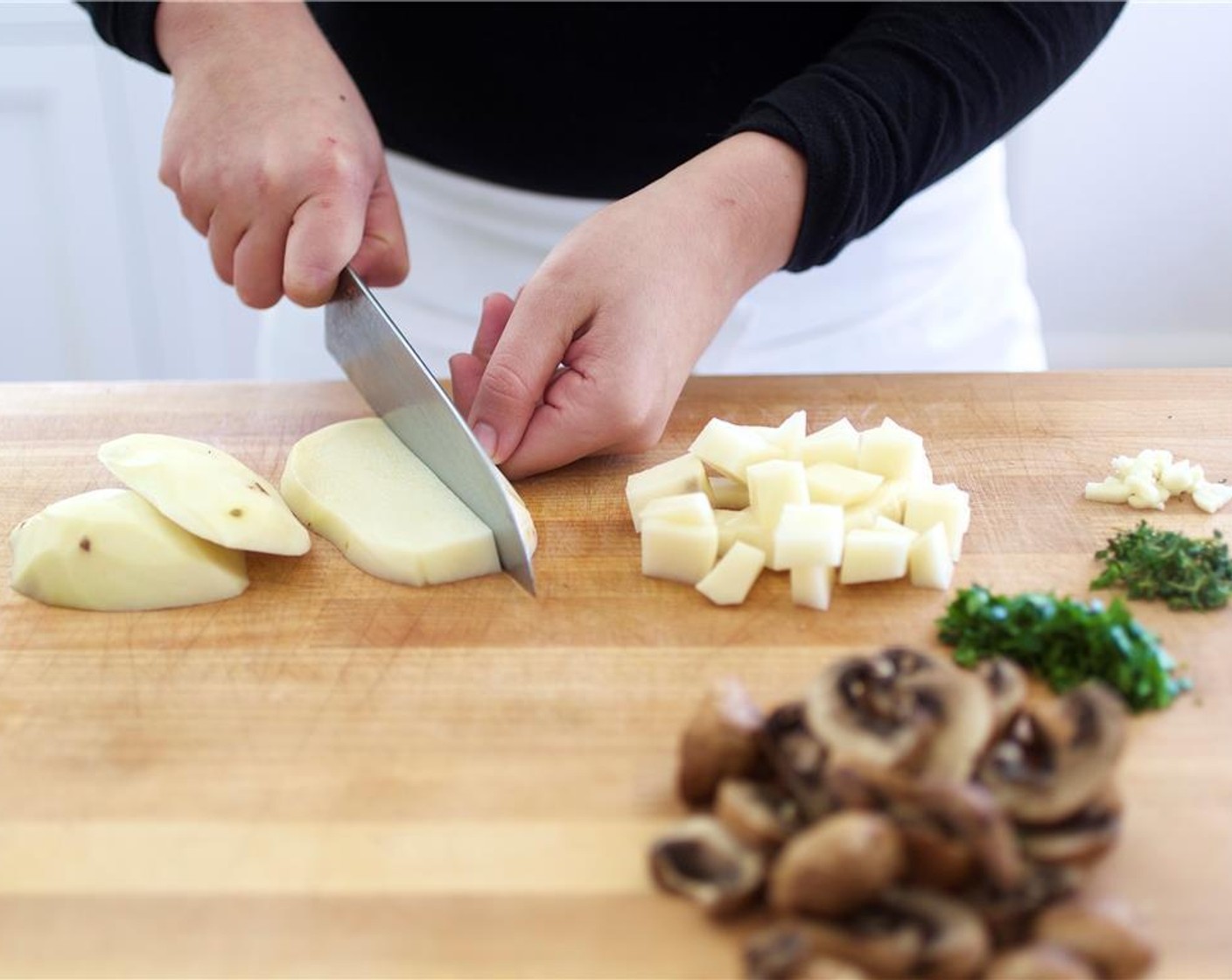 step 3 Peel Russet Potatoes (2) and cut into 1/4-inch cubes and place in a bowl. Toss with Olive Oil (2 tsp).