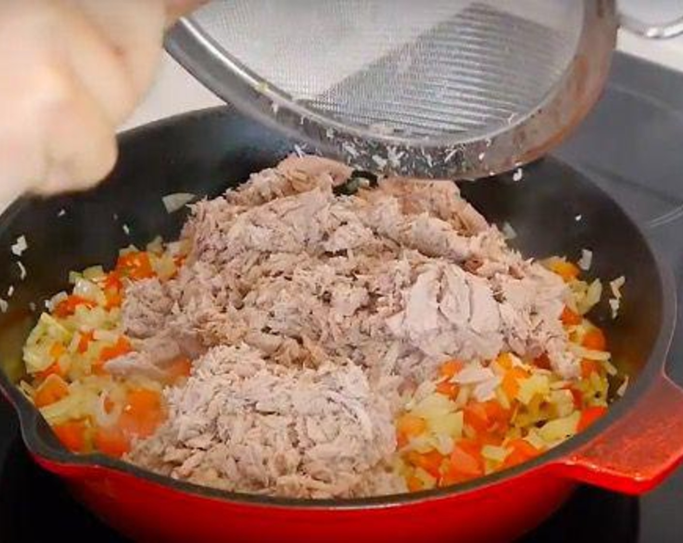 step 3 Then add the Canned Tuna (2 cups) which has been previously drained of any liquid or oil, and mix well. Season with Salt (to taste) and Ground Black Pepper (to taste) to taste and leave to cook for another 5 minutes. Then set aside to cool down.
