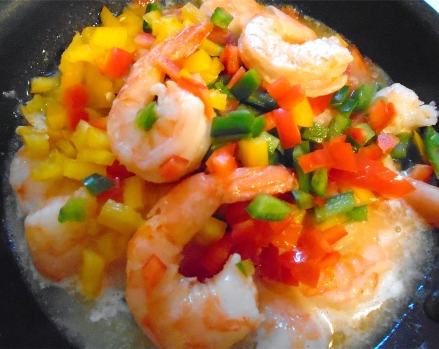 step 12 Saute the peeled Shrimp (2 cups) with the Garlic Paste (1 Tbsp), Red Bell Pepper (1 cup), Salt, and Cayenne Pepper (1 Tbsp) until shrimps are cooked, about 5 minutes.