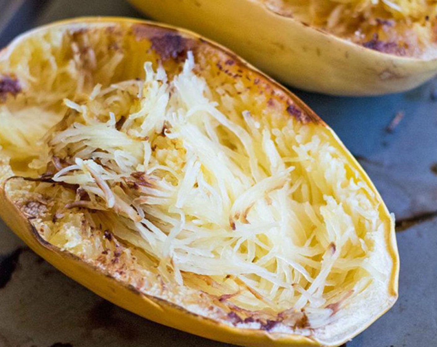 step 5 Once squash is cooked and cooled, use a fork to shred flesh into a large bowl. At this point, increase oven temperature to 400 degrees F (200 degrees C).