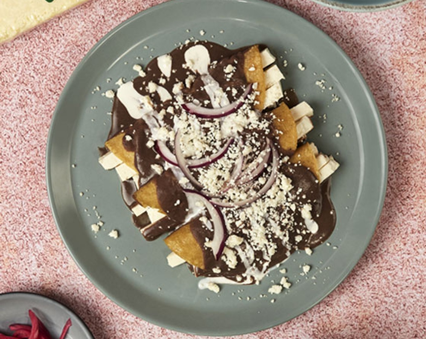 step 4 Top them with beans. Serve with La Vaquita® Crema Mexicana (1/2 cup), slices of Red Onion (1 slice), and shredded Cotija Cheese (1/2 cup).