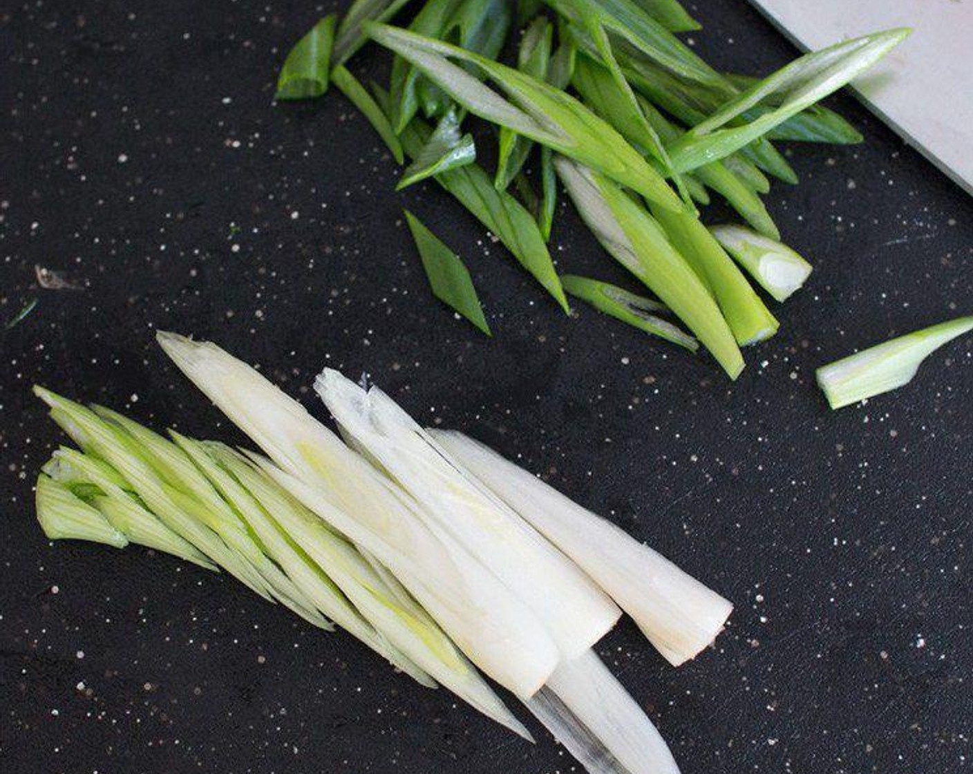 step 1 Cut the Scallion (1 bunch) into two parts (green and white), slice them up and then set aside, keeping the white and green parts separate.