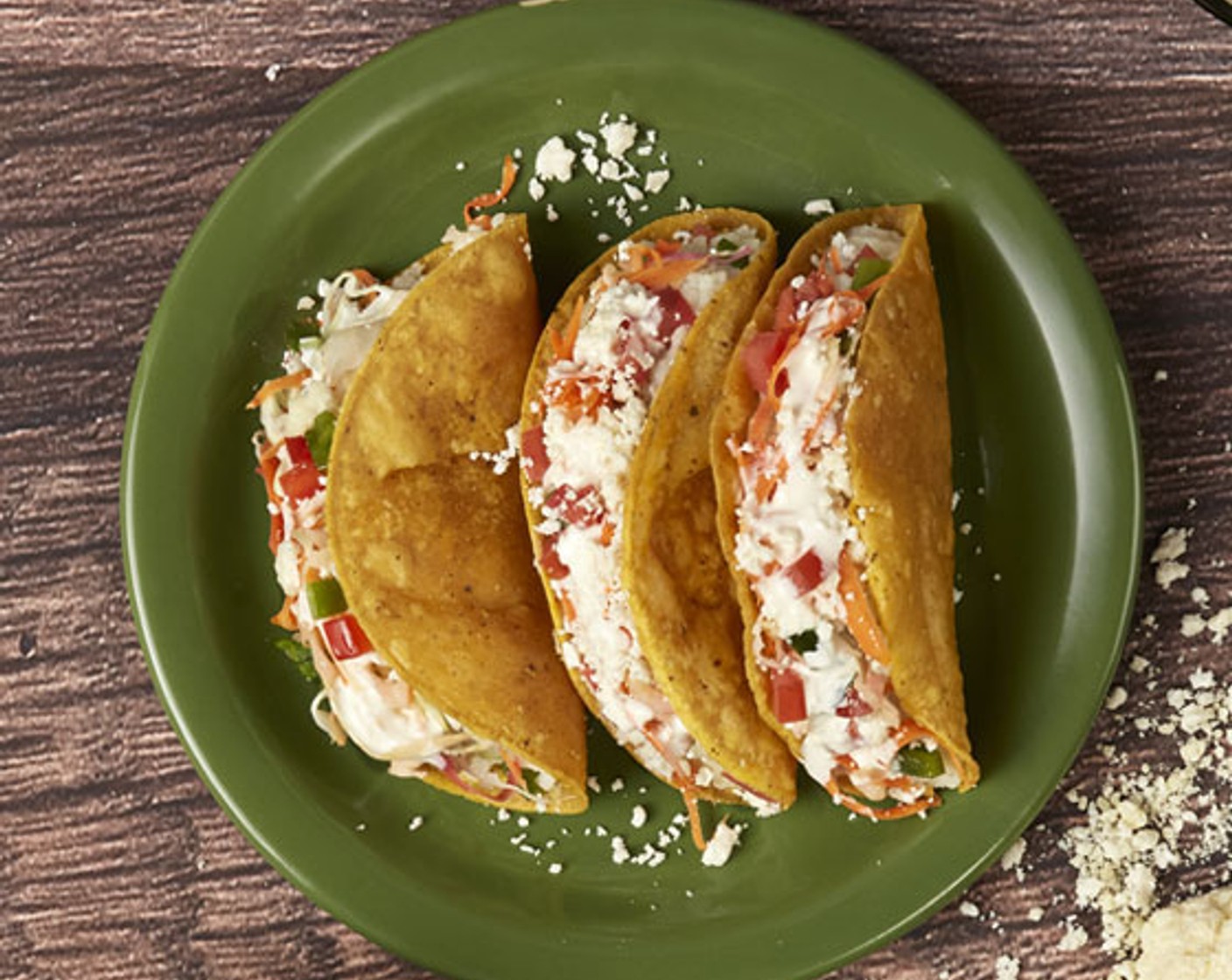 step 3 Finish with the Lettuce (1 cup), Salsa (1/2 cup), La Vaquita® Crema Mexicana (1/2 cup), La Vaquita® Queso Fresco (1/2 cup), and Red Onion (1/4).