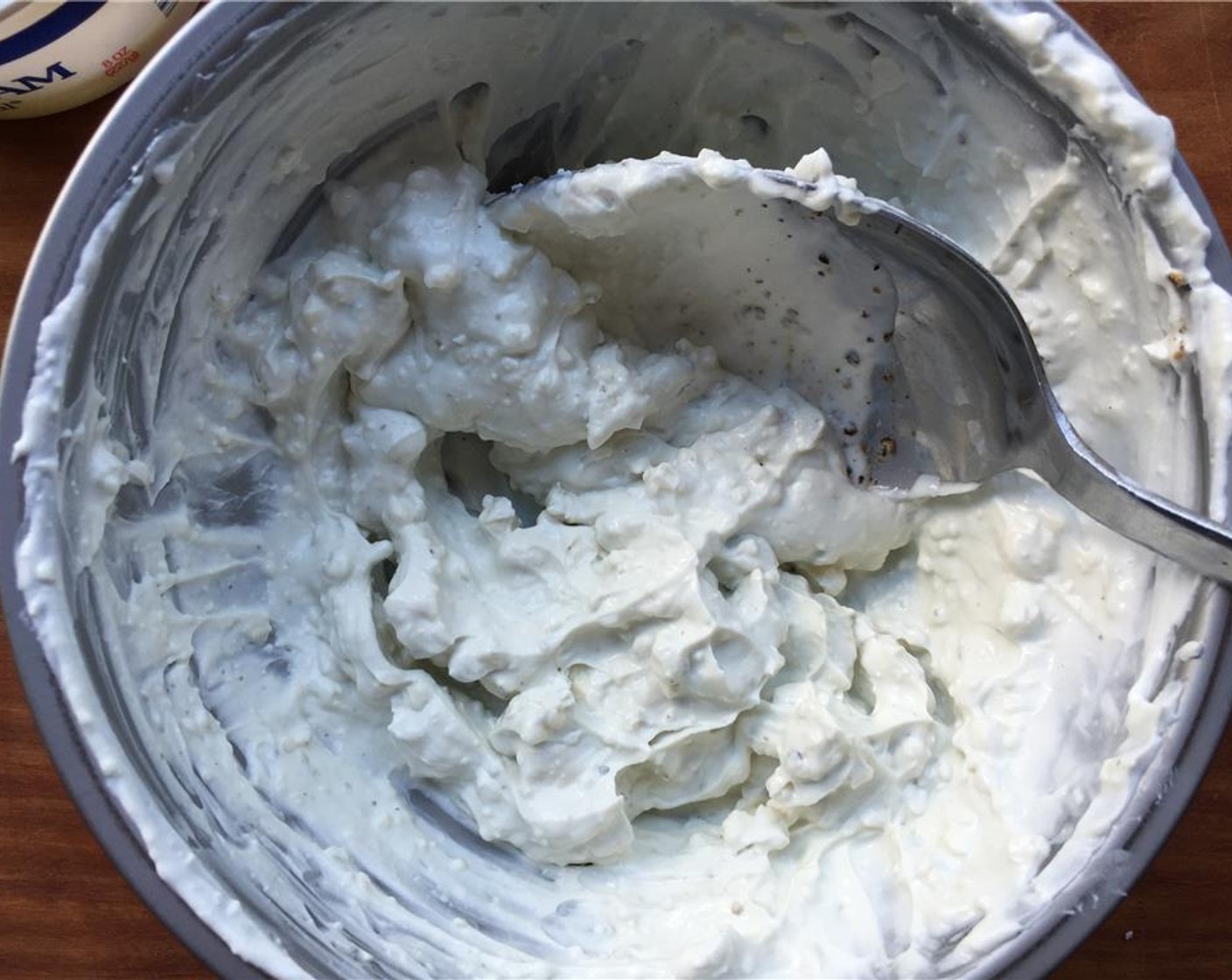 step 9 Add the Blue Cheese (3 Tbsp) and Sour Cream (1/4 cup) to a bowl and mix. Season with a pinch of Freshly Ground Black Pepper (to taste). Set aside.