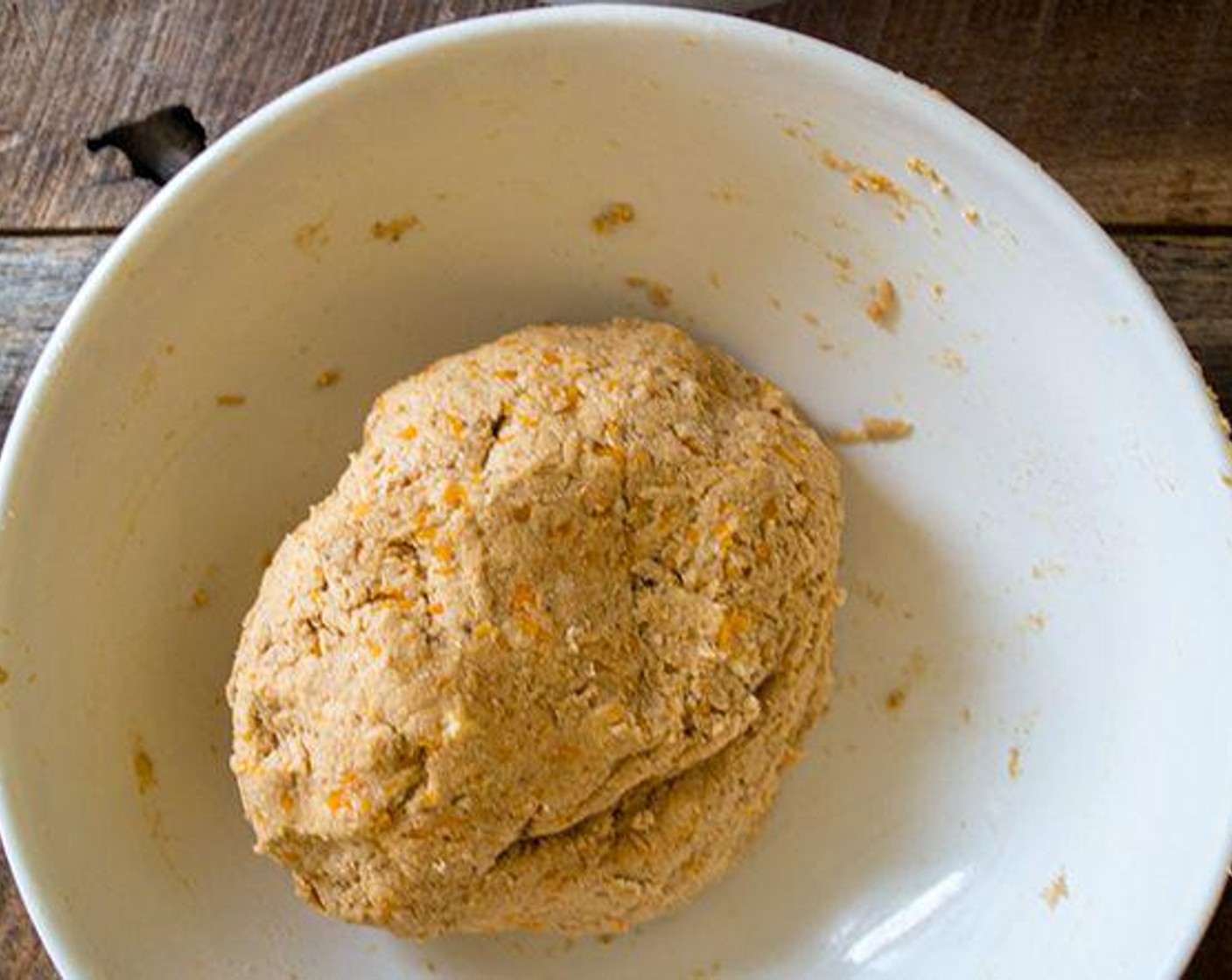 step 5 Pour over the biscuit batter and lightly mix until the dough comes together. The dough will be somewhat sticky.