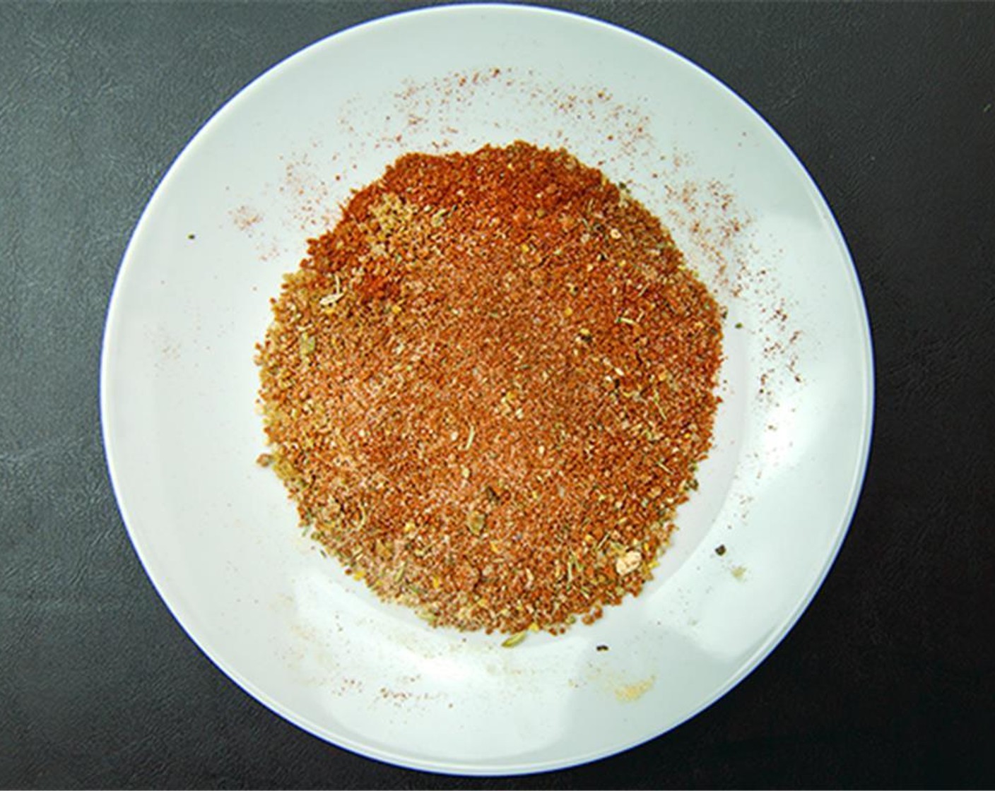 step 3 Combine Simply Organic Onion Powder (1/2 tsp), Brown Sugar (2 tsp), Simply Organic Garlic Powder (1/2 tsp), Paprika (1 1/2 Tbsp), Poultry Seasoning (1/2 tsp), freshly ground Ground Black Pepper (1/2 tsp), Chili Powder (1/2 tsp), and Cayenne Pepper (1 pinch).