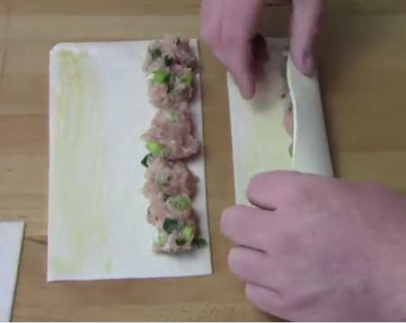step 2 Cut each Puff Pastry (3) in halves. Put the chicken mixture on one side of the halved pastry. Brush the opposite edge with the Eggland's Best Classic Egg (1), and roll the pastry up. Continue with the remaining sheets.