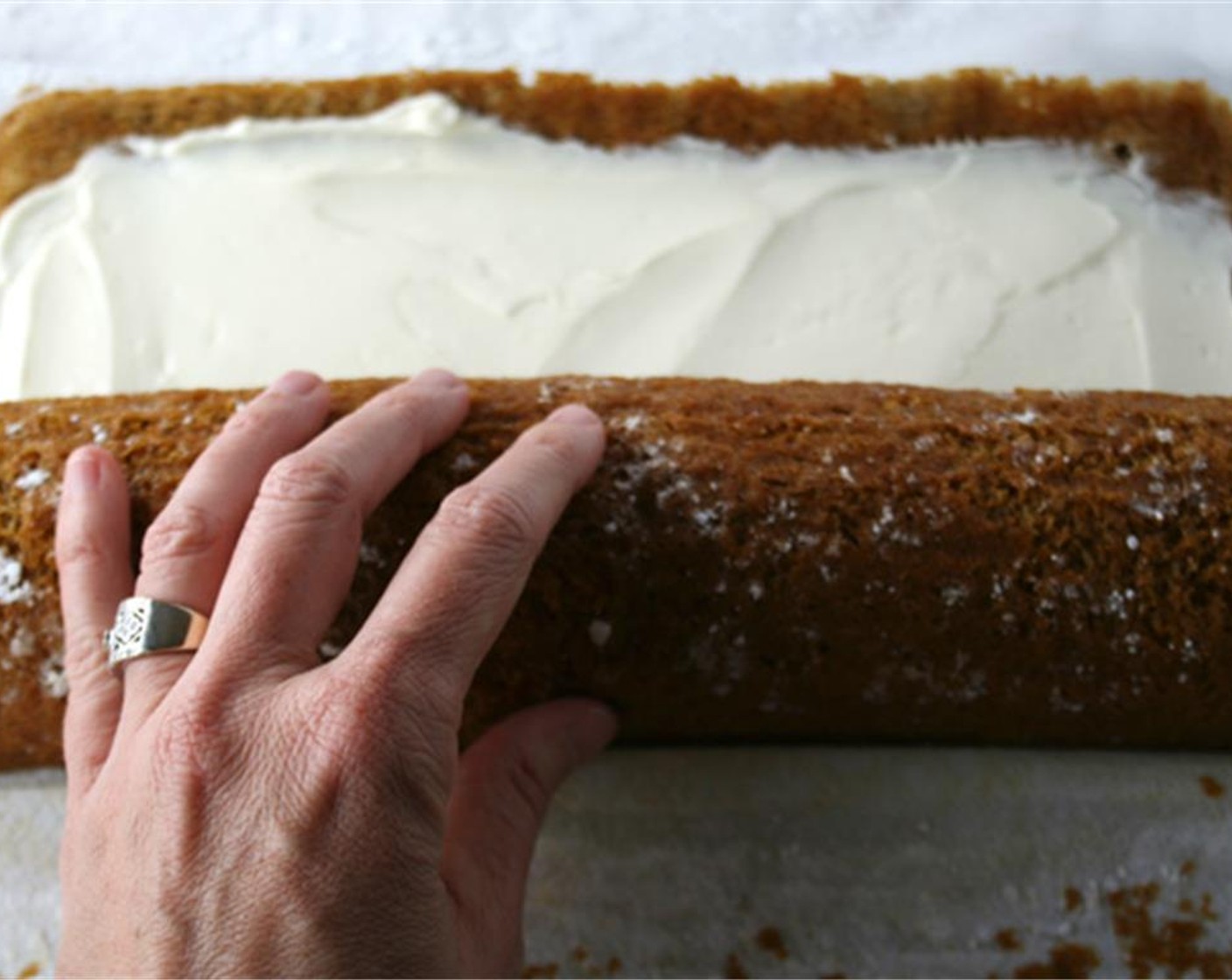 step 13 Spread cream cheese mixture over cake, and re-roll cake.