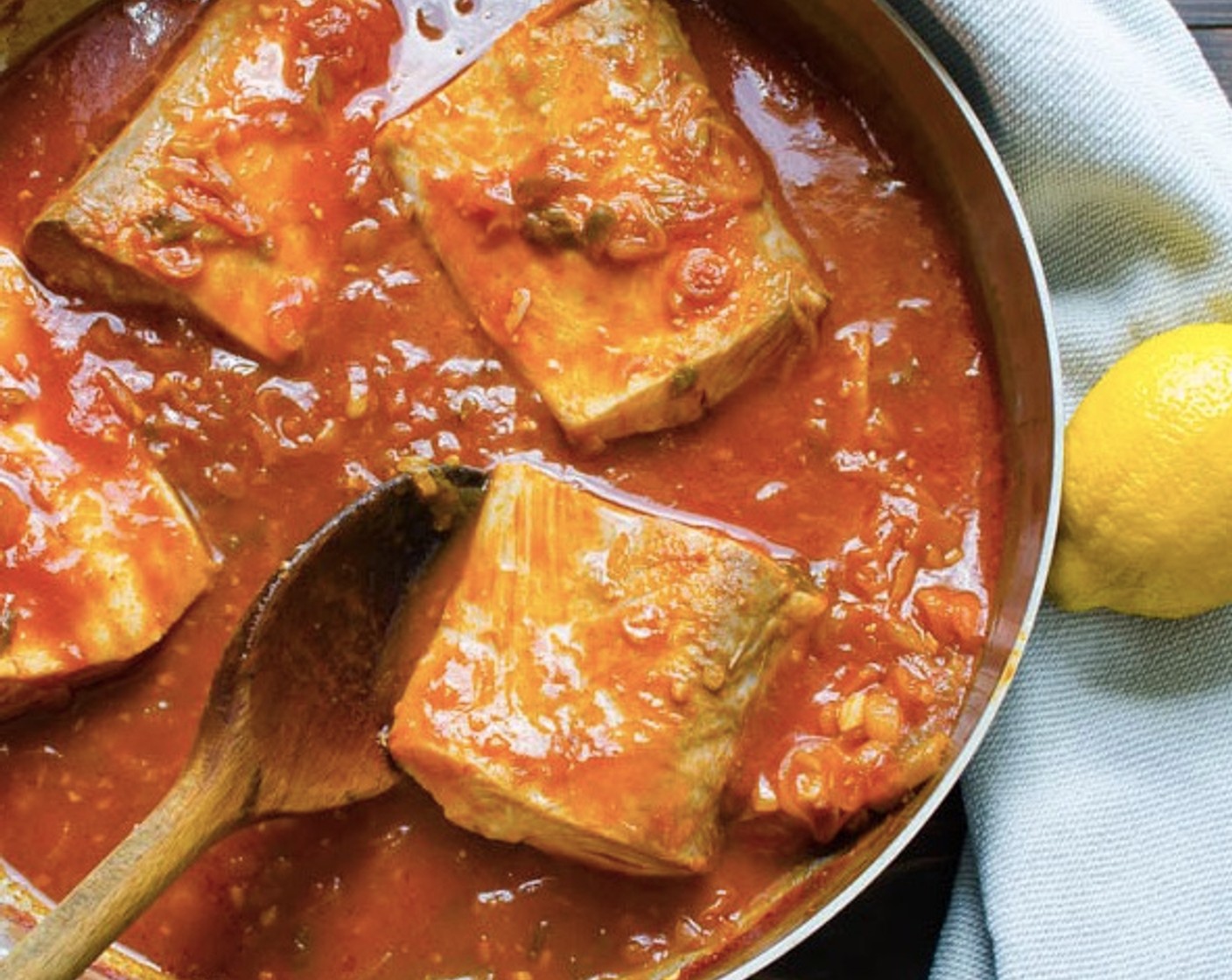 step 6 Using tongs or a spatula, flip the fish over and continue to poach an additional 7-8 minutes.