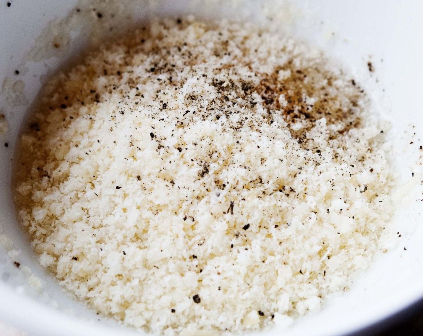 step 4 In a bowl beat up the Free Range Egg (1) with Parmesan Cheese (1 Tbsp), a pinch of salt and some ground pepper.