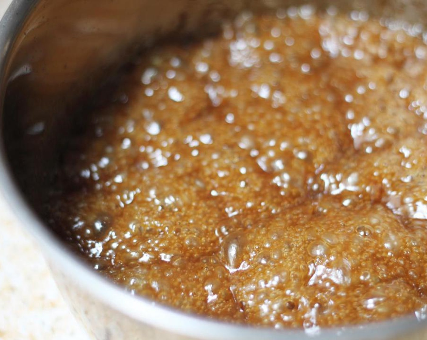 step 4 Bring the toffee mixture for around 3 minutes, continuing to stir. Working quickly and carefully, pour the toffee over the matzoh.