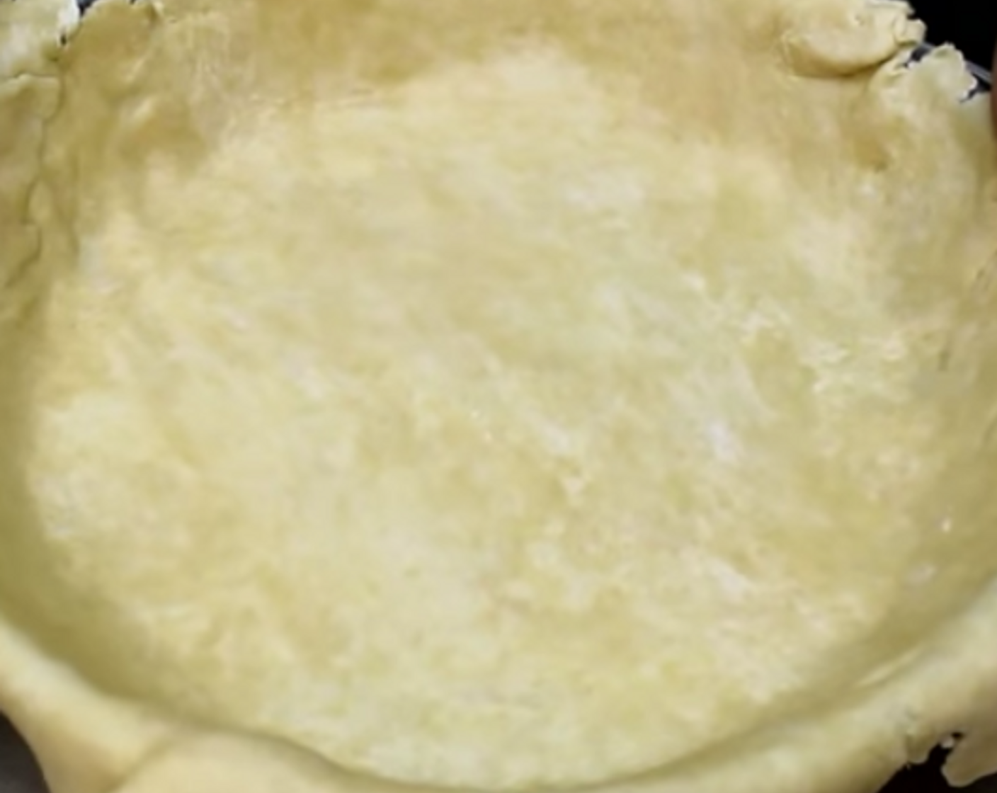 step 5 Transport your dough into your pie plate and remove the excess dough.