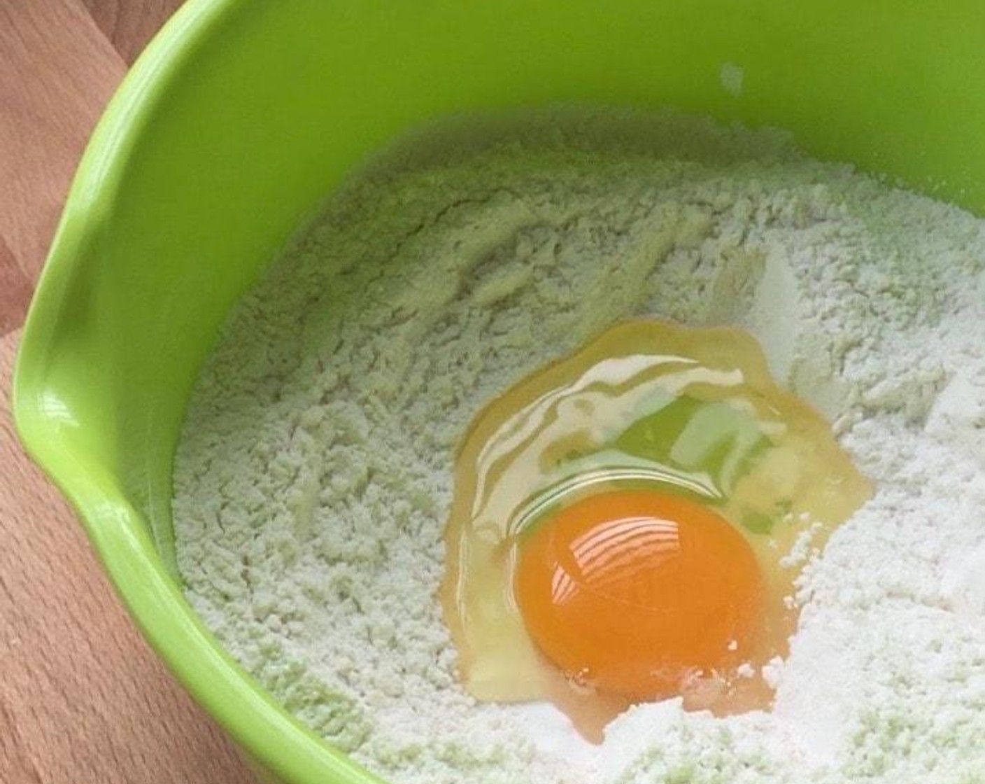 step 2 Make a hole or well in the center and pour in Eggland's Best Classic Egg (1).