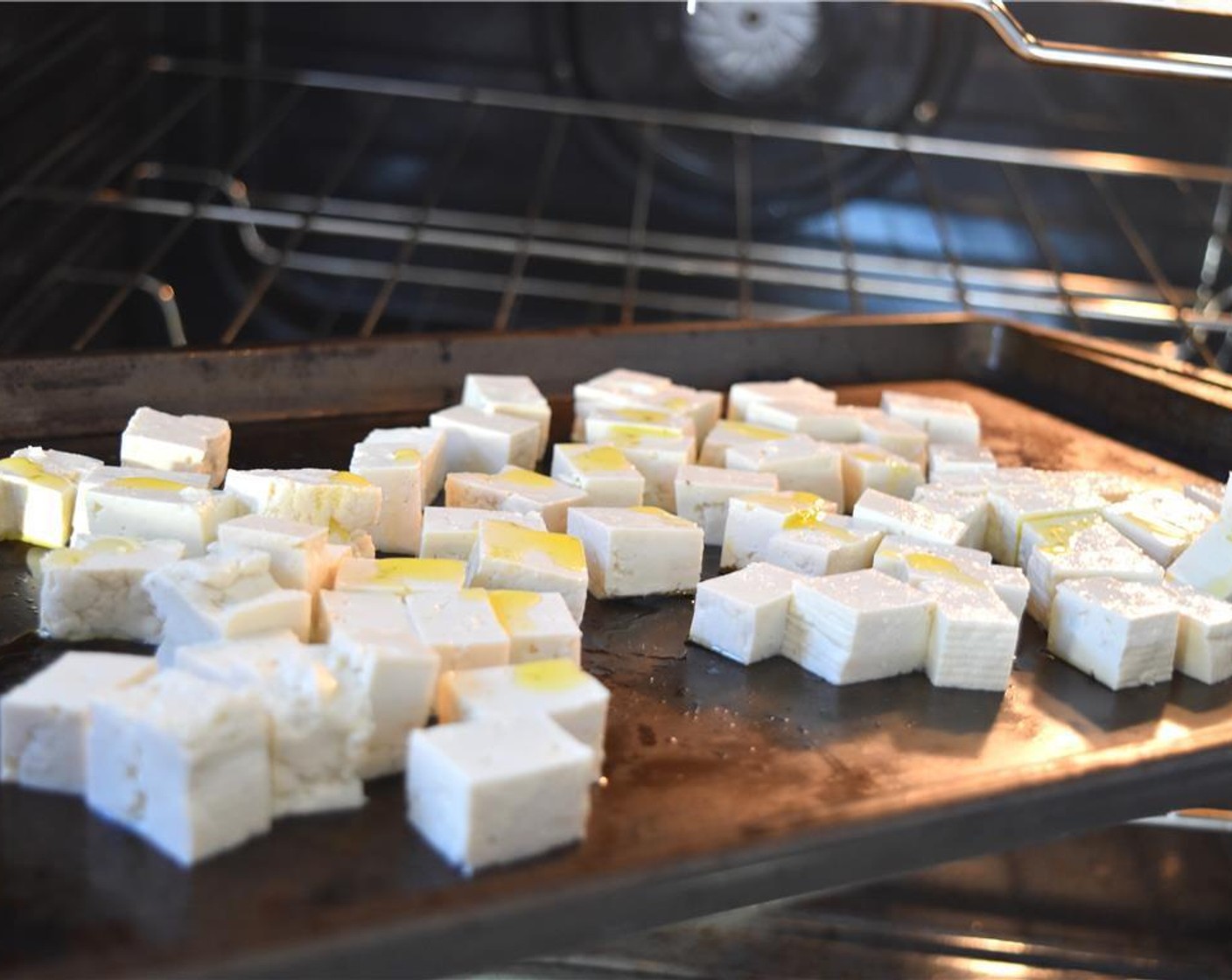 step 3 Toss Firm Tofu (1 pckg) in Extra-Virgin Olive Oil (1 Tbsp) and bake for 15 minutes in the oven or until light brown around the edges.