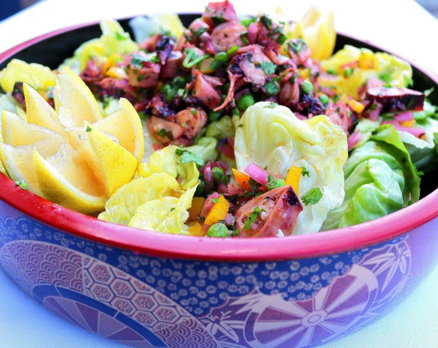 step 3 Plate the dressed lettuce, top with the marinated octopus. Serve and enjoy!