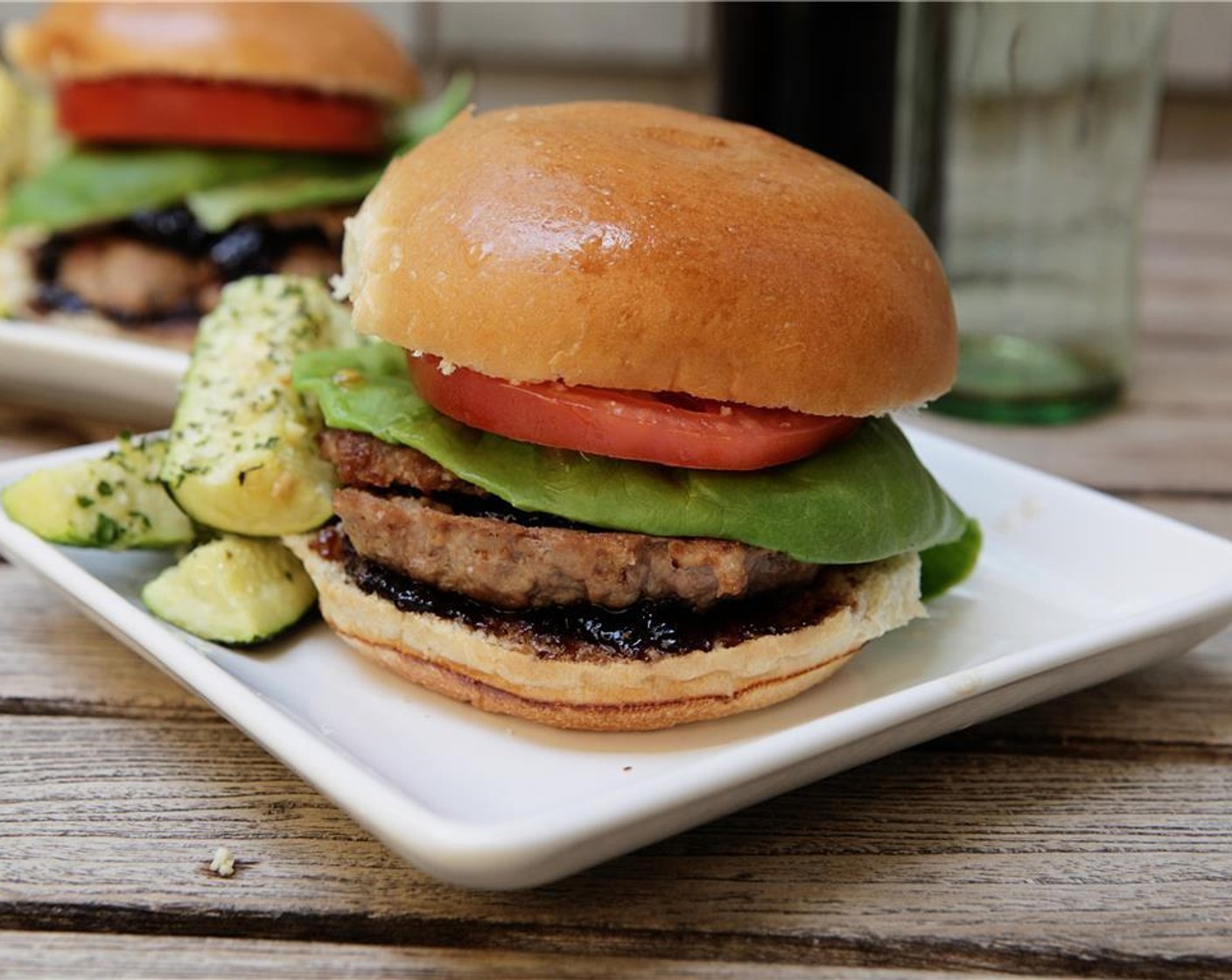 step 12 Place the second patty, then the lettuce, then the tomato, then the top of the bun. Serve and enjoy!