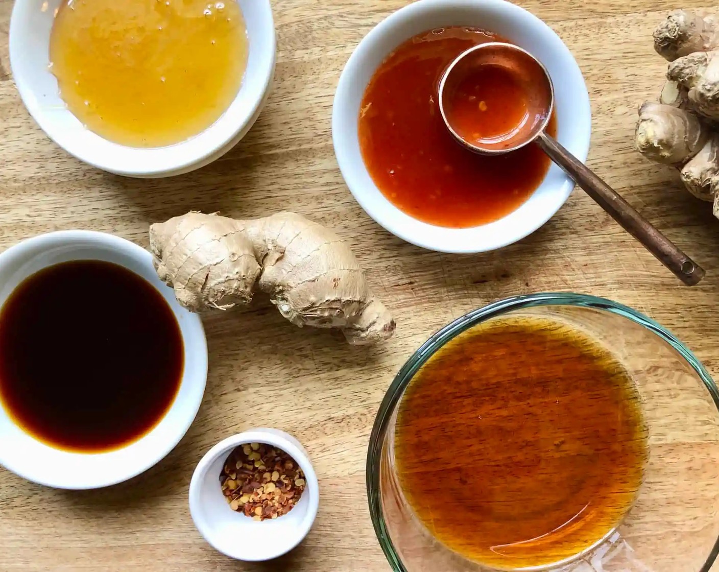 step 1 Start by making the sauce. Combine Toasted Sesame Oil (1/4 cup), Sweet Chili Sauce (2 Tbsp), Low-Sodium Soy Sauce (2 Tbsp), Honey (3 Tbsp), Fresh Ginger (1 piece), and Crushed Red Pepper Flakes (to taste) in a medium bowl. Set aside to serve alongside the dumplings.