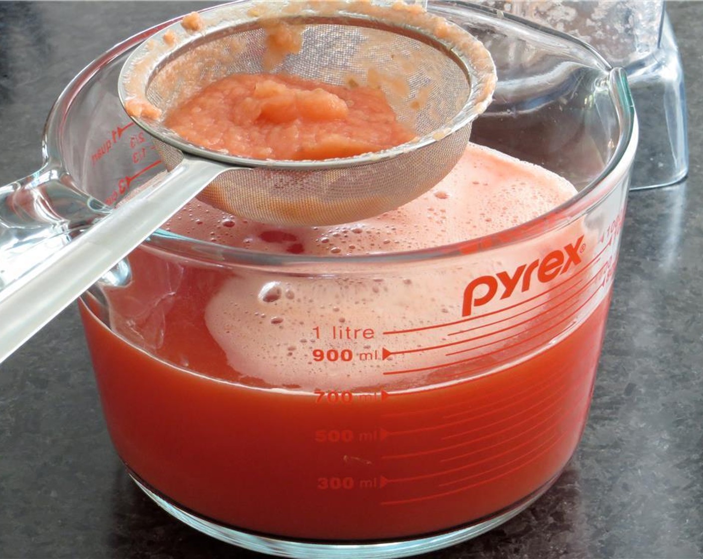 step 2 Add the Seedless Watermelon (4 cups) to the blender, and puree until very smooth. Place a fine mesh sieve over a small bowl or 4 cup measure. Strain pulp from juice through the sieve, pressing on the solids with the back of a spoon. Discard the solids.