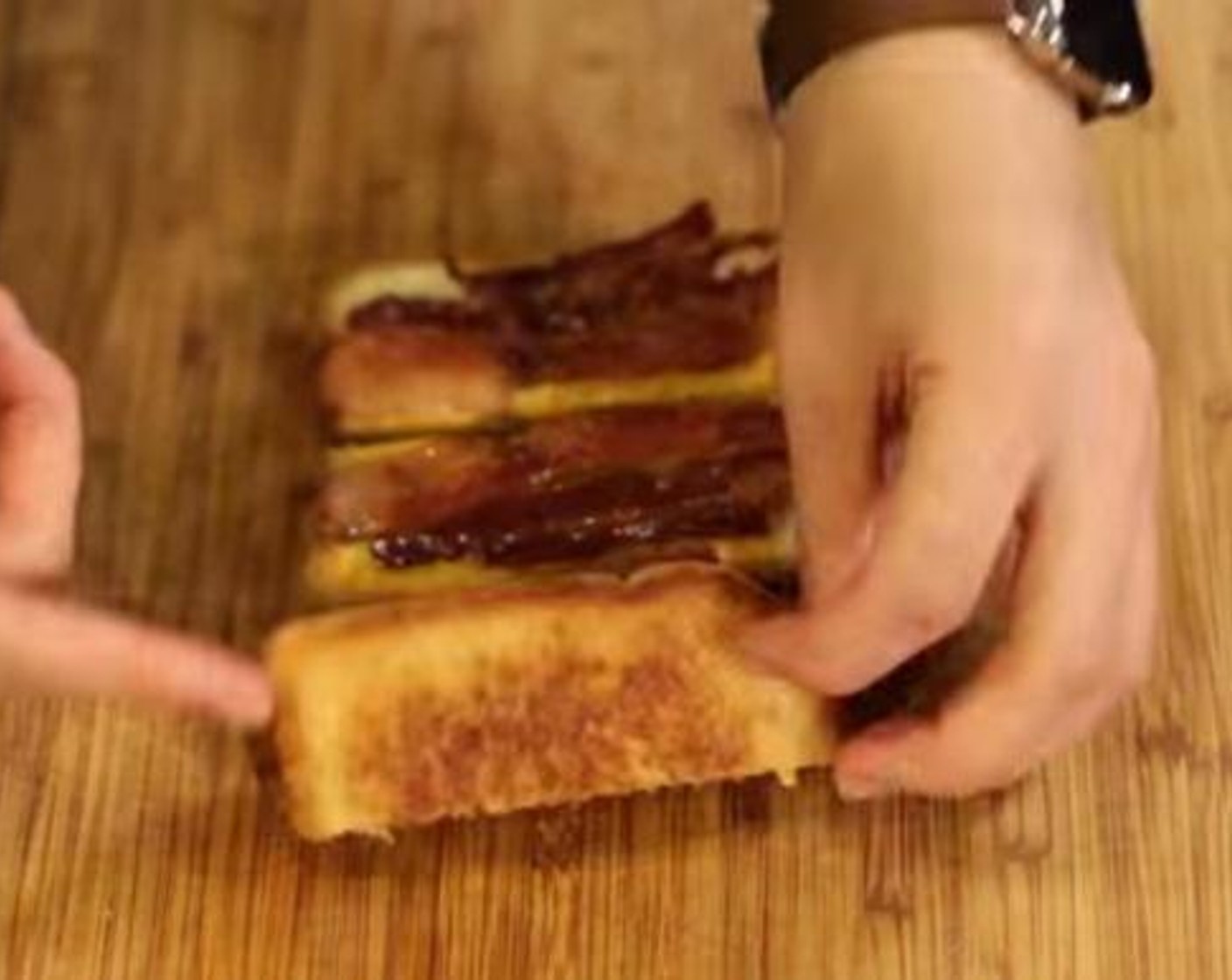 step 6 Flip the grilled cheese and bacon over, the bacon should be congealed to the cheese at this point.
