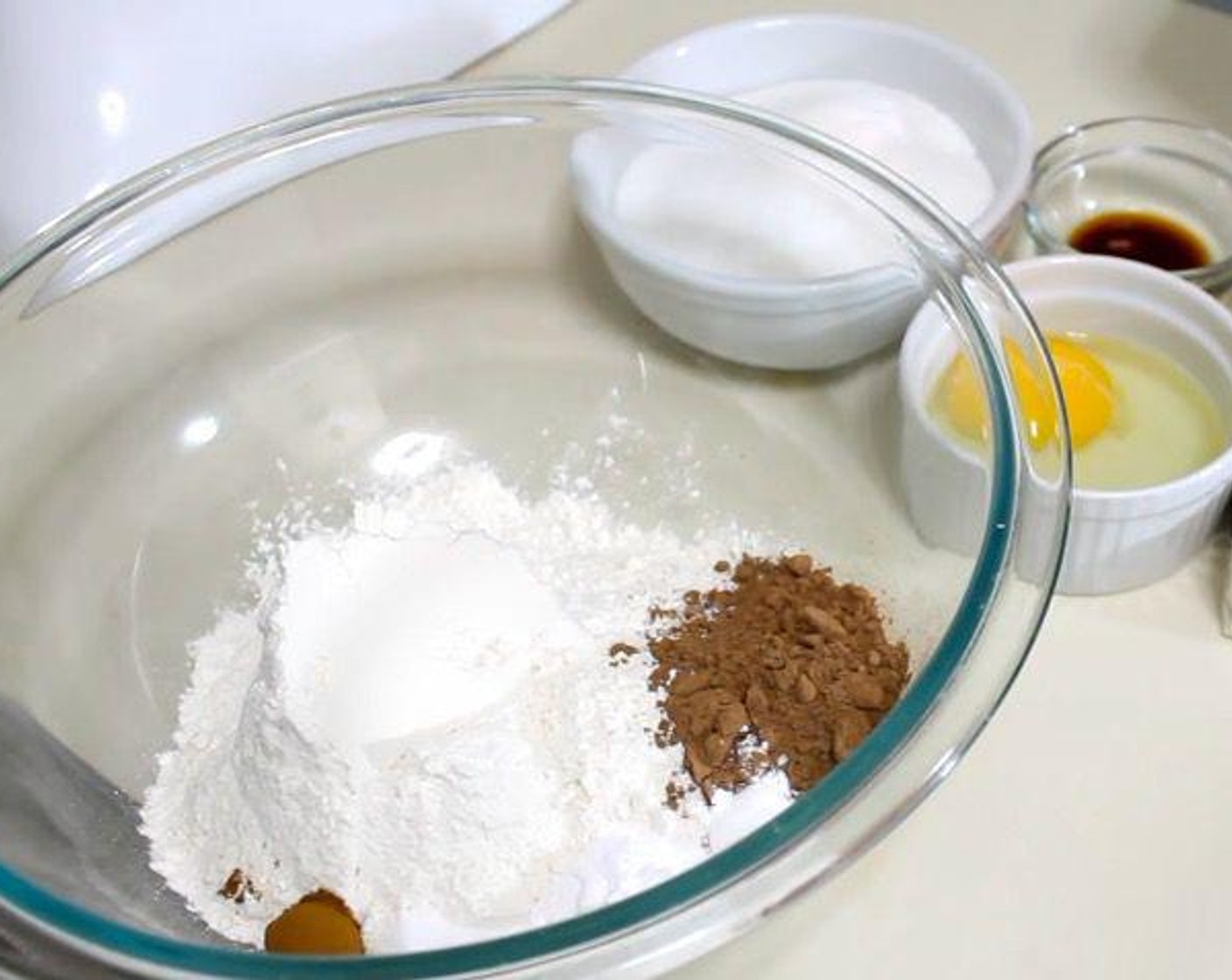step 2 In a mixing bowl, add All-Purpose Flour (1 1/2 cups), Unsweetened Cocoa Powder (3 Tbsp), Baking Soda (1 tsp), Baking Powder (1/4 tsp), Ground Cinnamon (1/8 tsp), and Salt (1/4 tsp). Stir to combine.
