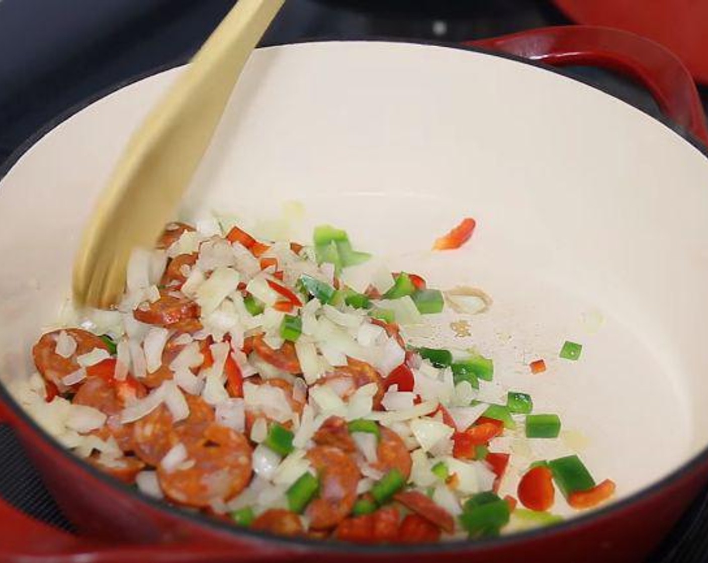 step 1 In a large oven-safe pan over medium high heat, heat Olive Oil (1 Tbsp). Add Red Bell Pepper (1/2), Green Bell Pepper (1/2), Garlic (3 cloves), Onion (1), and Spanish Chorizo (3.5 oz) and cook for 3-5 minutes or until it starts to soften. Stir in the garlic and cook for 30 second.