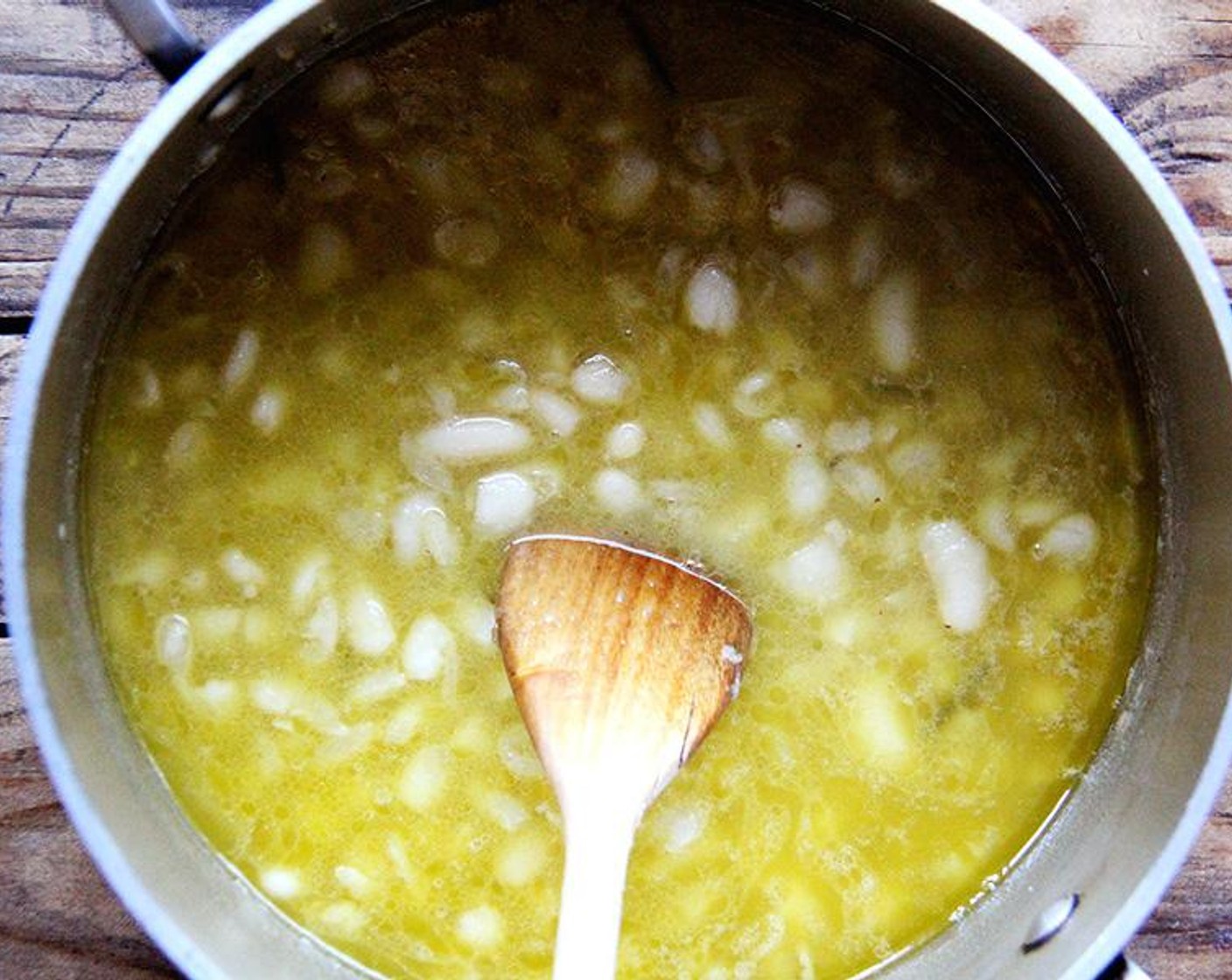 step 3 Uncover, add the Water (1 cup) and simmer for another 6-8 minutes or until some of the beans have broken down and turned the broth creamy. Taste, and adjust Salt (to taste) and Ground Black Pepper (to taste). Turn off the heat.