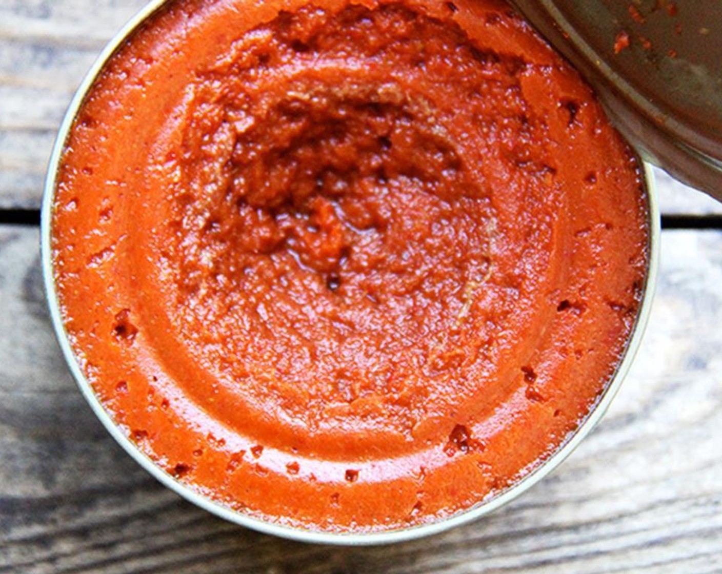 step 5 To make the peanut sauce, put Unsweetened Coconut Milk (1 can) and Thai Red Curry Paste (2 1/2 Tbsp) into a medium heavy-bottomed pot.