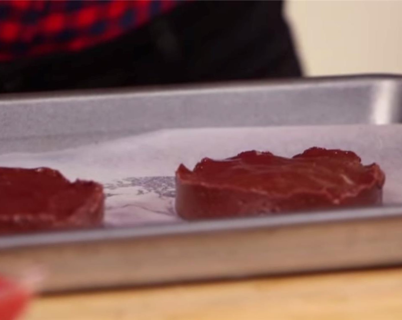 step 2 Line a half-sheet pan with waxed paper. Arrange two ring molds or round cookie cutters on the half-sheet pan and divide the nutella   between the two molds, spreading it smooth. Refrigerate for 20 minutes, or until firm.