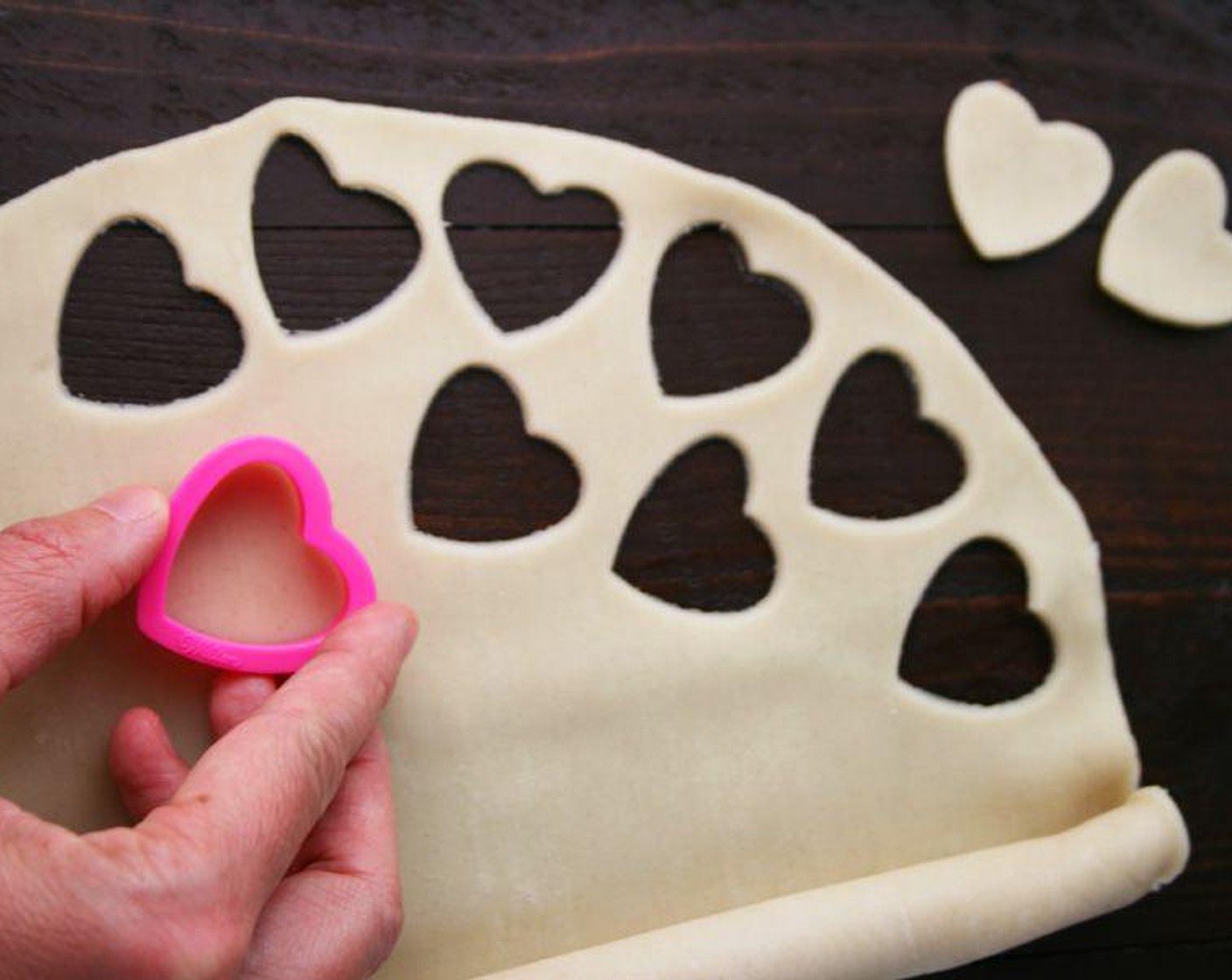 step 3 Spread the other Pie Crust (1) on a lightly floured surface and cut small hearts out using a 1-inch heart cookie cutter. Cut as many hearts as you can.