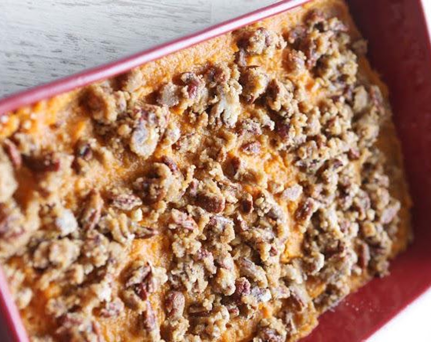 step 4 In a medium bowl, combine the Brown Sugar (1/2 cup), All-Purpose Flour (1/2 cup), Pecans (1 cup), and Butter (1/2 stick). Mix and pour evenly over sweet potatoes. Bake in the preheated oven for 20 minutes.